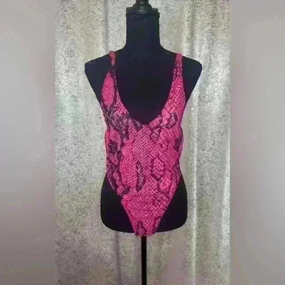 Never worn plunging snake skin bodysuit.